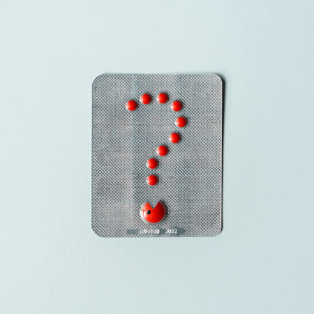 Blister with red pills in the shape of a question. Creative pharmaceutical concept.の写真素材