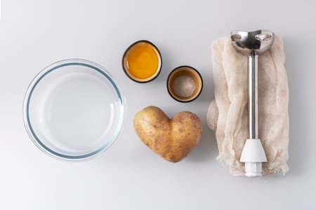 Process of cooking potato milk on white background. top view. Concept of alternative milk.の写真素材