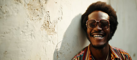 Portrait of a smiling young African American man wearing sunglassesの素材