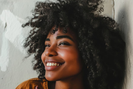 Portrait of a beautiful young African American woman with curly hairの素材