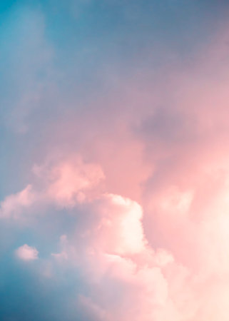 Soft pink clouds against a light blue sky, creating a soothing and dreamy atmosphere