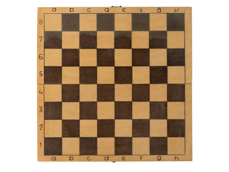 Handmade wooden chessboard with uneven markings and visible imperfections, simple design and rustic...