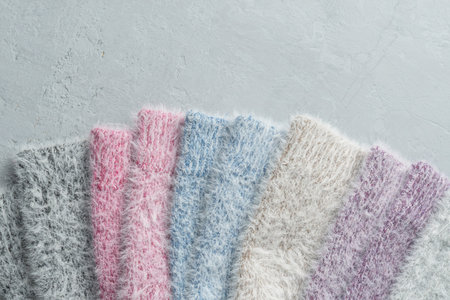 Set of soft fluffy socks made from luxurious blend of cashmere and mink in pastel colors, displayed...