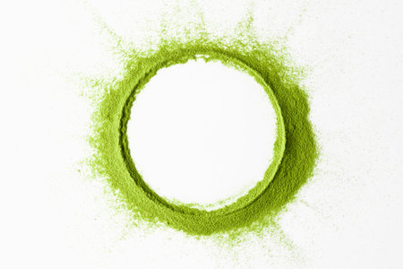 Vibrant ring of matcha powder forms a crisp circle on white, leaving copy space for branding, packaging, menus, or wellness ads.の写真素材