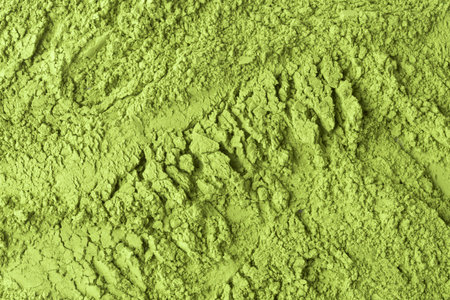 Coarse matcha powder landscape with rugged crags and fine dust creates vivid organic texture for culinary, wellness design.の写真素材