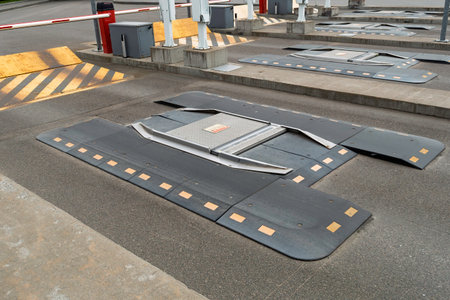 Inspection ramp at checkpoint shows vehicle scanning system with raised panels, emphasizing controlled access and transport safety workflow.の写真素材