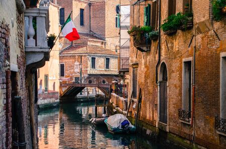 Traditional view of Venice, old area, old walls, small bridge.の写真素材