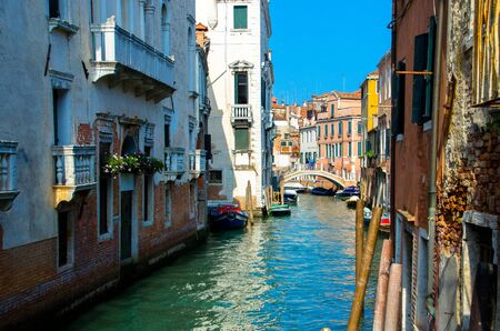 Sunny view of Venice, old area, old walls, pedestrian bridge.の写真素材