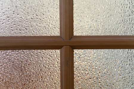 abstract background. window with wooden frame close-up.texture of corrugated glass. design for Wallpaper, or desktop. beautiful blur on the edges.の写真素材