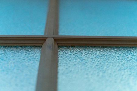 abstract background. window with wooden frame close-up.texture of corrugated glass. design for Wallpaper, or desktop. beautiful blur on the edges.の写真素材