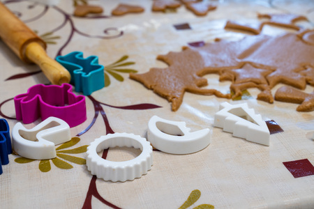 the process of cooking cookies at home. cut cookies from dough using shapes. the view from the top.の写真素材