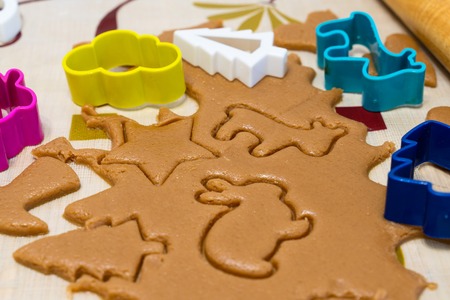 the process of cooking cookies at home. cut cookies from dough using shapes. the view from the top.の写真素材