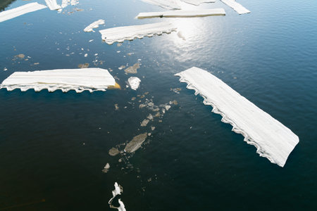 cracked ice on river in spring time
