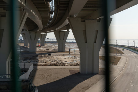 modern pedestrian bridge across the Bay in St. Petersburg. the concrete supports of the bridge...