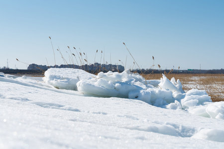 Snow and pieces of broken ice on the Baltic sea coast. beautiful seascape