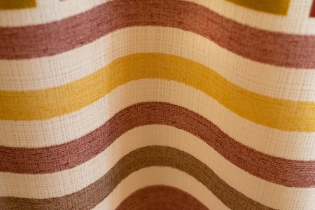 abstract background colored stripes on the texture of the fabric folded wave.close-upの写真素材
