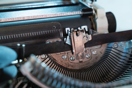 Abstract background with metal part and elements of retro-writing machine. keyboard with black keysの写真素材