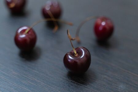 berries fresh ripe cherries on a wooden background. berries and fruits close-upの写真素材