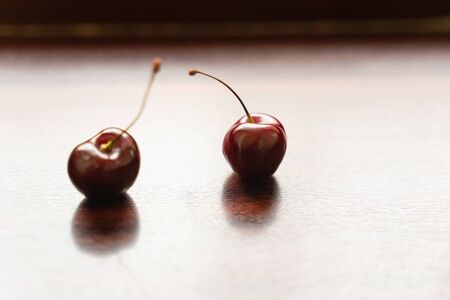 berries fresh ripe cherries on a wooden background. berries and fruits close-upの写真素材