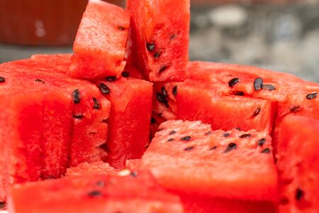 sliced pieces of ripe red watermelon close up as background or Wallpaper designの写真素材
