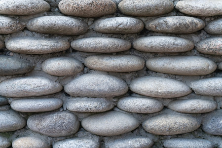 template background texture of a wall made of granite gray polished stone