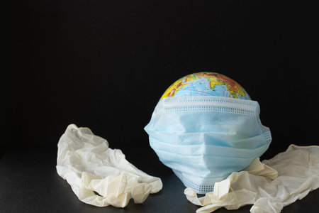 Corona virus concept. world earth put mask to fight against Corona virus. Concept of fight against...