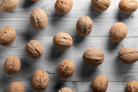beautiful background. walnuts on a wooden table top view.の写真素材