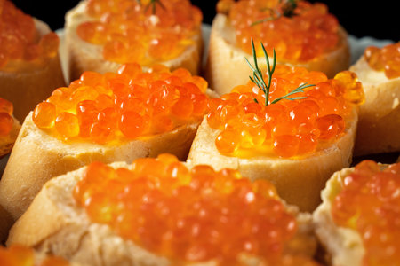 slices of white bread with red caviar