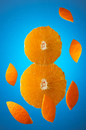 orange slices in the shape of the number 8 on a blue background. Greeting card, postcard for Women's Day March 8th. Concept of holidays, greetings. Copy space for design, ad.の写真素材