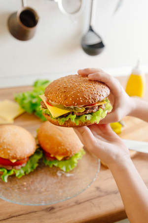 Homemade burgers. Burgers cooked at home kitchen.の写真素材