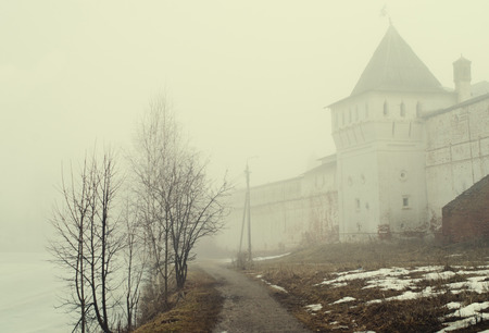 spring morning mist at the walls of the monastery from the 16th century (Borisoglebsky, Yaroslavl region, Russia)の写真素材