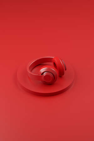 Vertical image of bright headphones on a red background. Monochrome modern audio background design. 3d illustrationの写真素材