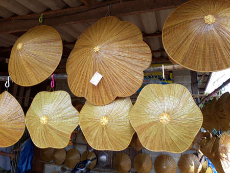 Hanging straw hat. Various shapes of woven hats were hung.の写真素材