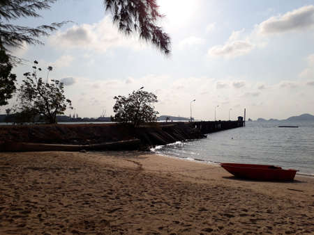 The beach in front of the pier. The sunset beach where a port jutting into the sea.の写真素材
