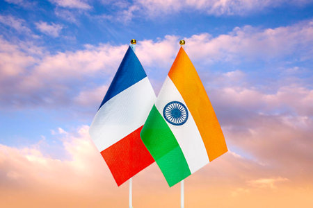 National flags of France and India against the sky at sunset. Flags.の写真素材
