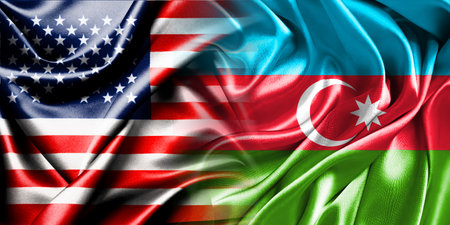 The national flags of the United States and Azerbaijan are combined into one and placed side by side on a fluttering cotton background.の写真素材