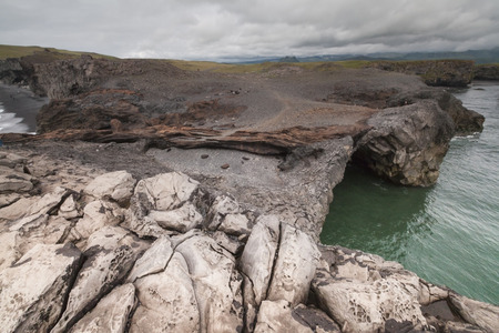 The small peninsula, or promontory, Dyrholaey,(formerly known as Cape Portland by English seamen) is located on the south coast of Iceland, not far from the village Vk.の写真素材