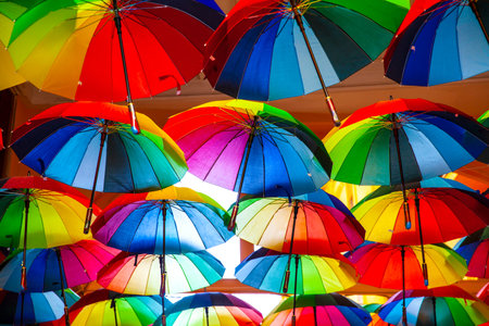 Rainbow gay pride protection symbol in hanging umbrellas