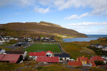 Scenic panoramic landscape of a picturesque village of Eidi with football stadium and traditional...