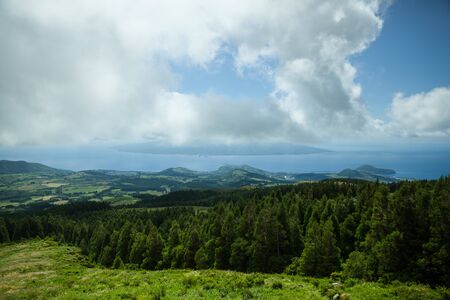 Landscape of Faial island showing agricultural fields and the atlantic oceanの写真素材