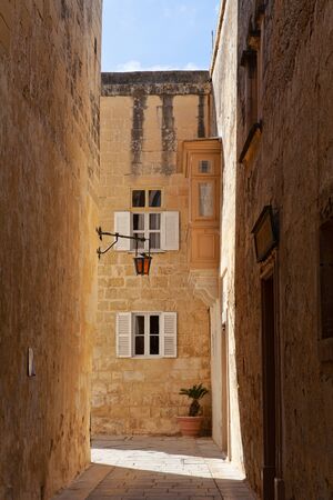 Narrow medieval street in ancient city of Mdina, Maltaの写真素材