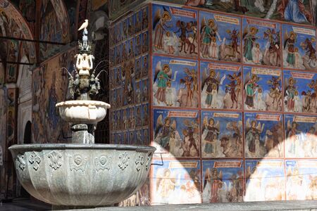 Outer corridor with frescoes and fountainsの写真素材