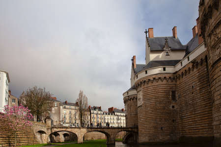 Nantes, France: 22 February 2020: Entrance gate and bridge to Castle of the Dukes of Brittanyのeditorial素材