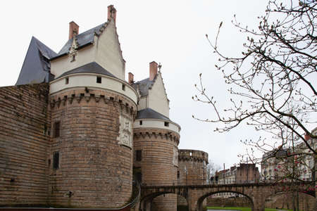 Nantes, France: 22 February 2020: Entrance gate and bridge to Castle of the Dukes of Brittanyのeditorial素材