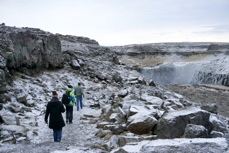 Dettifoss waterfall, Iceland - 6 November 2016: Travelers going along Jokulsa a Fjollum river to Dettifossのeditorial素材