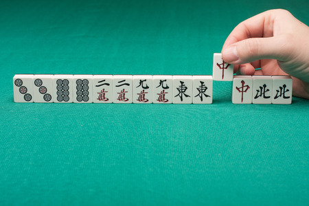 Smooth table surface with a mahjong on itの写真素材