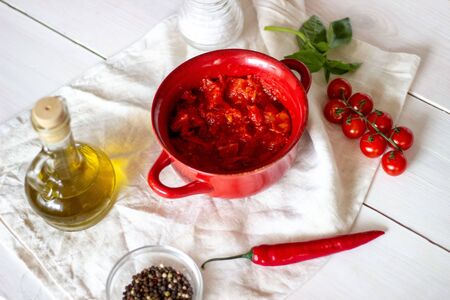 Chopped tomatoes with olive oil on a white background. Top view.の写真素材