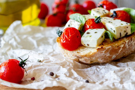 Bruschettas with tomatoes and cheese. Italian cuisine. Simple style. Vegetarian food