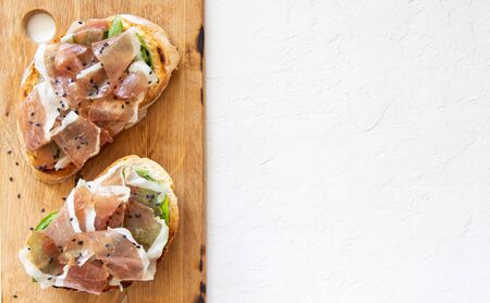 Bruschetta with prosciutto . Italian cuisine. National foodの写真素材