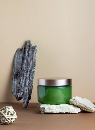 Cosmetics on a brown background. Design. Minimal concept. Spa. Skin care products. Copy space. Mock-up.の写真素材